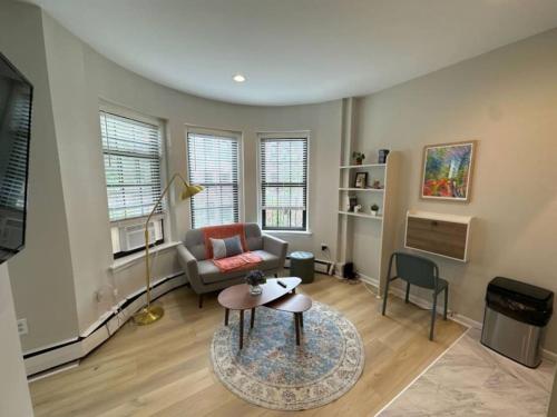 a living room with a couch and a table at South End Blissful Studio in Boston