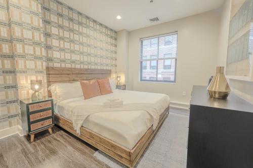 a bedroom with a large bed and a window at Boston Financial District 1BR Walk to anything in Boston