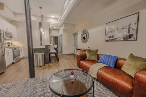 a living room with a couch and a glass table at Classic and Chic Apartment 1 Bedroom in Boston
