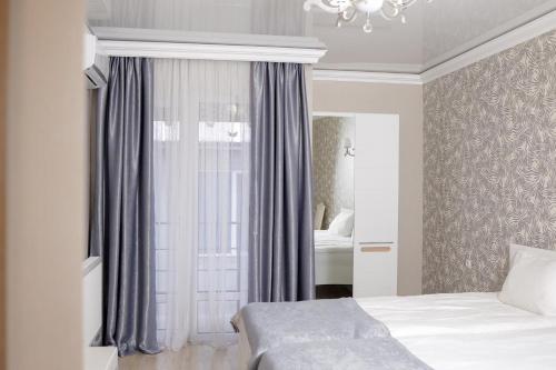 Ένα ή περισσότερα κρεβάτια σε δωμάτιο στο Hotel Stas