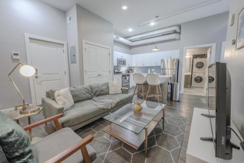 a living room with a couch and a table at Pet Friendly Downtown Boston Elevator Washer Dryer in Boston