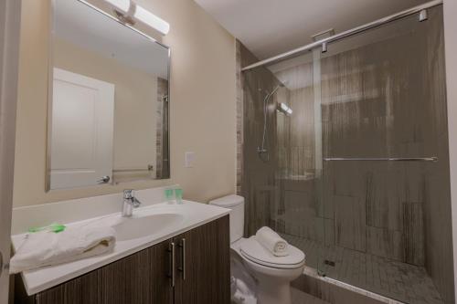 a bathroom with a toilet and a sink and a shower at Downtown Designer Home Keyless Washer and Dryer in Boston