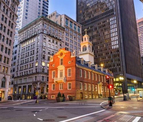 a building in the middle of a city with tall buildings at Airy, Modern 1BR downtown Boston in Boston