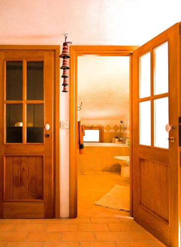 an open door to a bathroom with a toilet at Riomaggiore Fisherman's House con Parcheggio vicino alla spiaggia in Riomaggiore