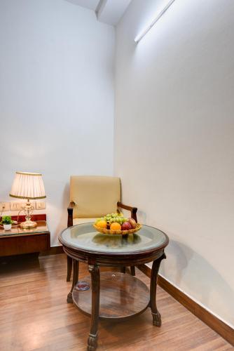 a bowl of fruit on a table in a room at Hotel Chanchal Deluxe - New Delhi Train Station in New Delhi