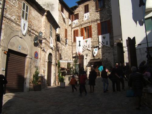 a group of people walking down a street at Greatview Narni in Narni
