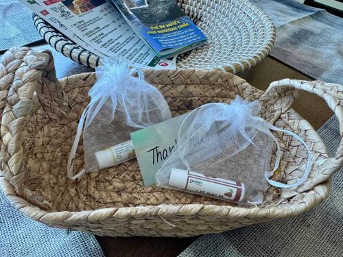 a basket with a book and a tube of toothpaste at Castle beach studio,tennis court and swimming pool with beach access in Miami Beach