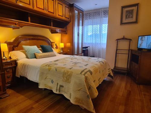 Posteľ alebo postele v izbe v ubytovaní Casa Campelo - APTO Playa de Rodeira Cangas, Garaje y WiFi gratis