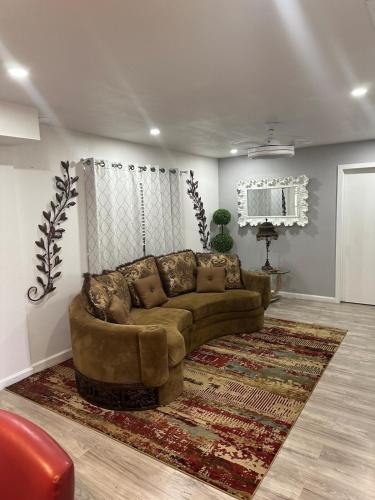 a living room with a couch and a rug at Casa De Colores - Airport - Fiesta Tx - The Pearl in San Antonio