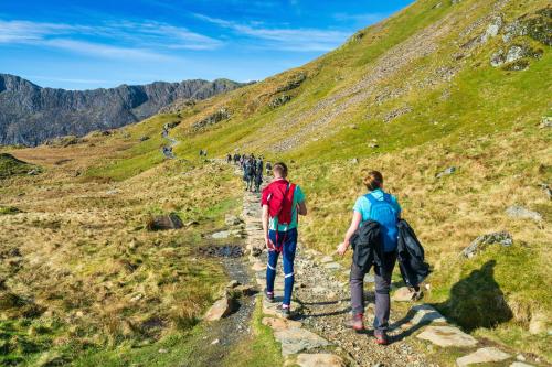 a group of people walking on a mountain trail at Cosy 8 Berth Caravan At Ty Mawr Holiday Park, North Wales Ref 86008D in Conwy