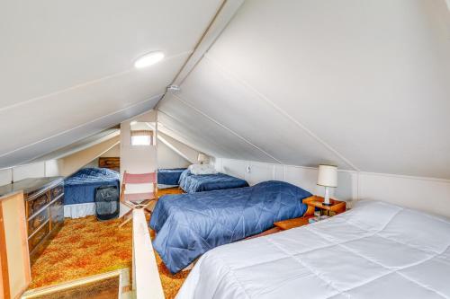 a room with two beds in a room at 8 Mi Barnegat Lighthouse Apt with Balcony! in Surf City