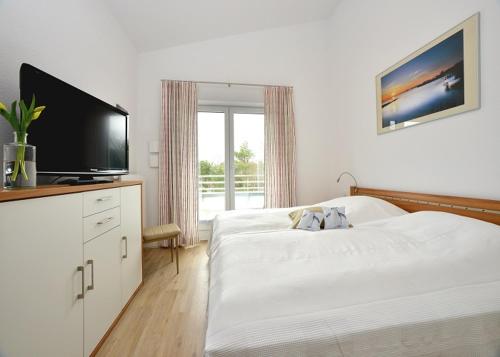Postel nebo postele na pokoji v ubytování Ferienwohnung Strandkorb