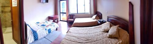 a bedroom with a bed and a couch at Lloresa in Cuenca