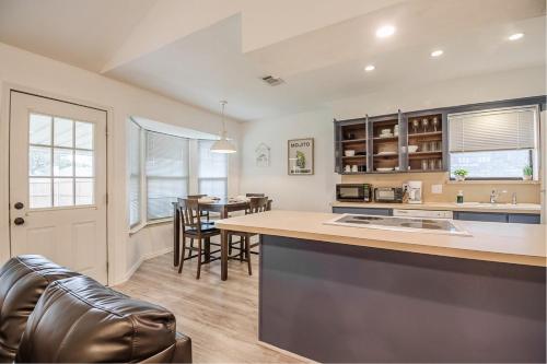 a kitchen and dining room with a table and chairs at Family friendly home in DFW area in Watauga
