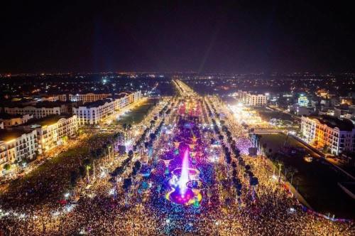 a city lit up at night with lights at Khách Sạn Minh Tâm Sầm Sơn in Sầm Sơn