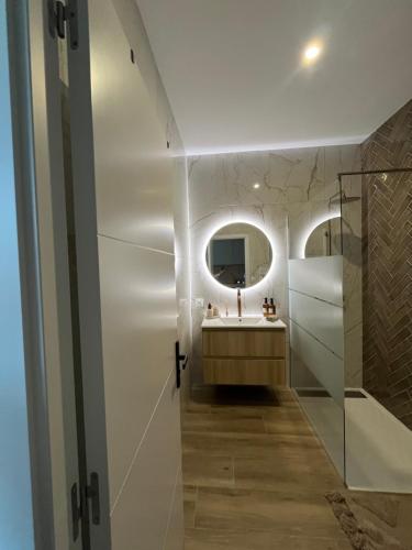 a bathroom with a sink and a mirror at Casa Del Ness in Givet