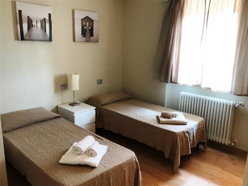 Ένα ή περισσότερα κρεβάτια σε δωμάτιο στο Villa Oliveta