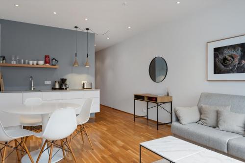 a living room with a couch and a table at Reykjavík Central Apartments in Reykjavík