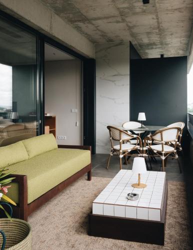 a living room with a couch and a table at Flair Living in Vila Nova de Gaia