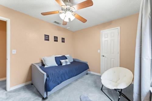 a bedroom with a bed and a ceiling fan at Hackberry Hideaway in Frisco