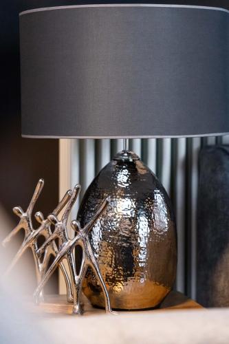 a bronze lamp sitting on top of a table at Ma Maison No5, Private Heated Pool, Acropolis View in Athens