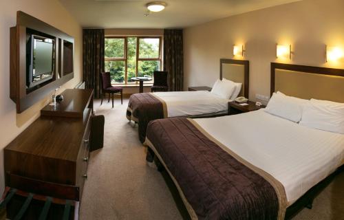 Postel nebo postele na pokoji v ubytování Westport Woods Hotel & Spa