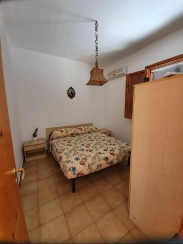a bedroom with a bed in a room at Casa vacanze Donna VALERIA in San Foca