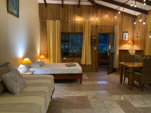 Ένα ή περισσότερα κρεβάτια σε δωμάτιο στο Pura Vida Boutique Apartments