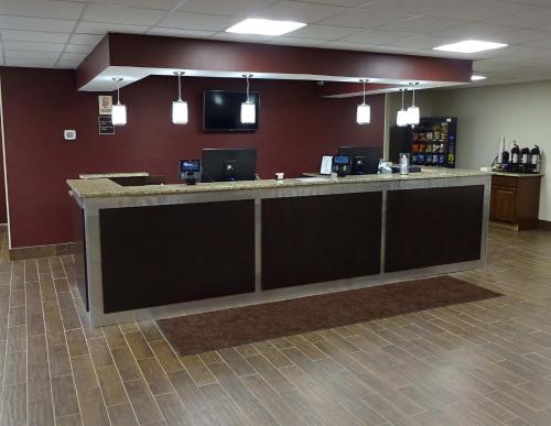 a lobby with a large counter in a office at Red Roof Inn Indianapolis - Castleton in Indianapolis