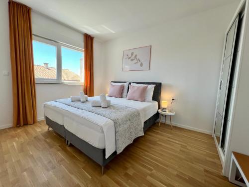 Ένα ή περισσότερα κρεβάτια σε δωμάτιο στο Apartment WILD ROSE