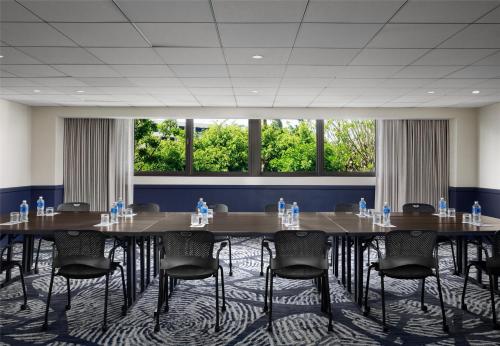 a large conference room with tables and chairs at Sonesta Los Angeles Airport LAX in Los Angeles