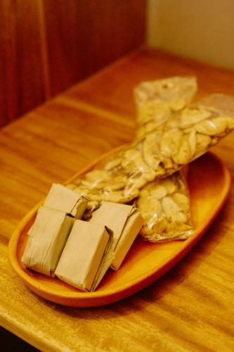 a plate of food on a wooden table at Hotel Casa Selvaggio in Ráquira