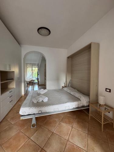 a large bedroom with a large bed in a room at Tenuta Magrè in Ischia Town