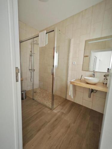 a bathroom with a shower and a sink at Casa da Marta - Azorean Nature Escape in Nordeste