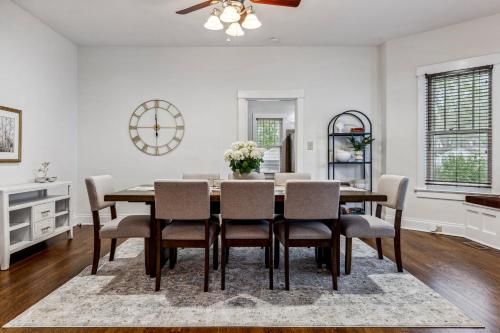 a dining room with a table and chairs at Fifth Street Retreat by StayLage in St. Charles