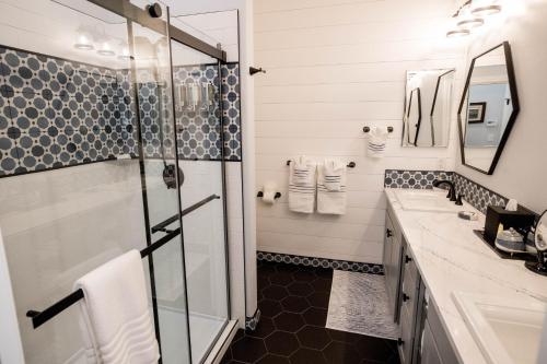 a bathroom with two sinks and a shower at ONX WINES - Clark House Apartment in Templeton