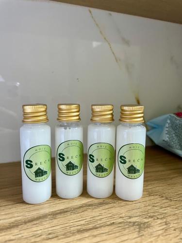 four bottles of milk sitting on a table at Moje srećno mesto in Arandjelovac