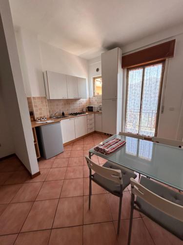 a kitchen with a table and chairs in a room at Casa Miralago in Menaggio