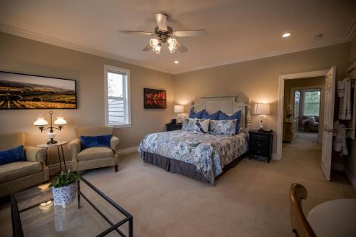 a bedroom with a bed and a ceiling fan at ONX WINES - Clark House & Apartment in Templeton