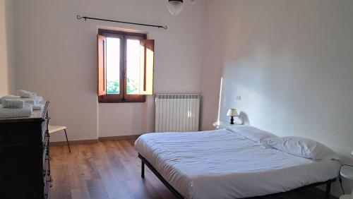 Katil atau katil-katil dalam bilik di Agriturismo Frigionaia