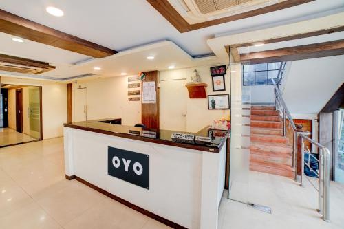 a lobby of a house with a noo counter at Hotel O Ganpati in Bhopal