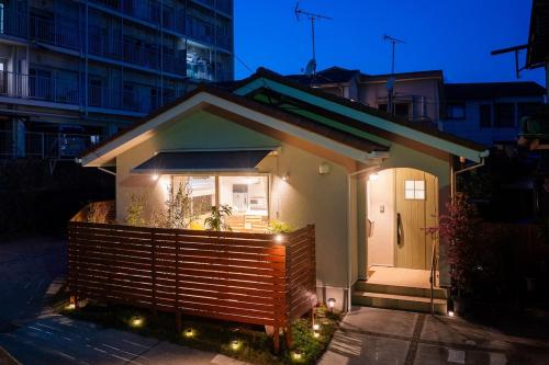 a small house with lights in front of it at 朝食付きGuest House Fu-ga in Kagoshima