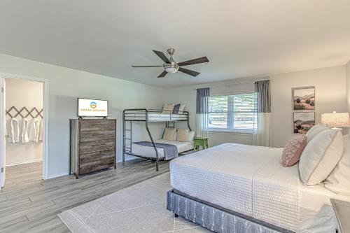 a bedroom with a bed and a ceiling fan at Two Docks on Riverside in Kingsland