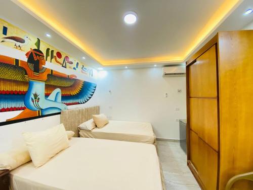 Ένα ή περισσότερα κρεβάτια σε δωμάτιο στο Jewel Pyramids View Boutique Hotel