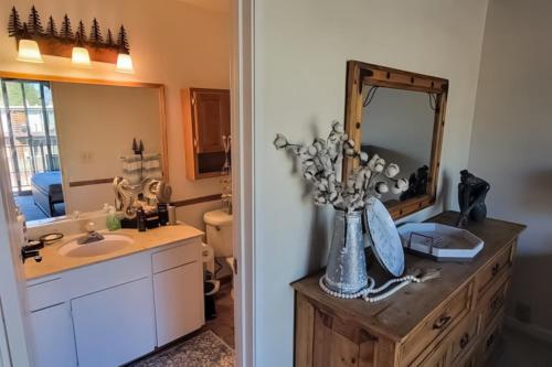 a bathroom with a sink and a mirror at Cozy Lakeside Retreat in South Lake Tahoe