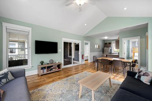 a living room with a couch and a table at The Hemlock - 1 Hollow in Cherry Valley