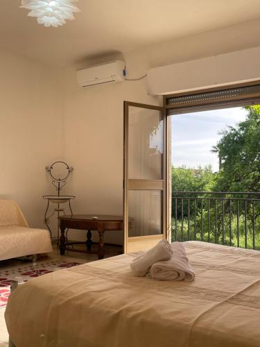 Ένα ή περισσότερα κρεβάτια σε δωμάτιο στο Giulietta's House