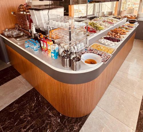 a buffet line with many different types of food at Grand Heykel Hotel in Bursa