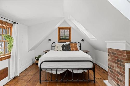 a bedroom with a bed in a attic at Jericho Mountain Lodge in Glen