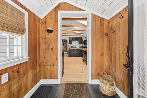 a hallway of a home with wooden walls at Jericho Mountain Lodge in Glen